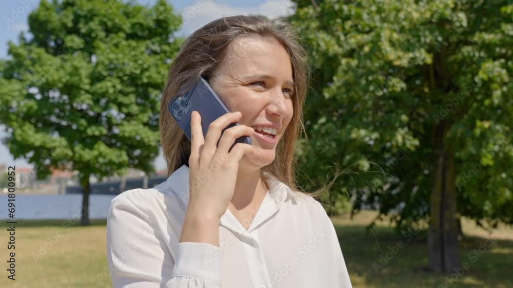 Woman explaining story through phone, wearing elegant work clothes, slowmo Woman explaining story through phone, wearing elegant work clothes, slowmo