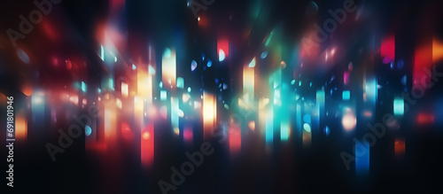 Abstract blurred defocused retro film overlay with colorful light on a black background.
