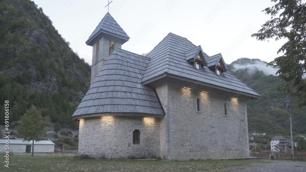 Antique Exterior Of Church Of Theth, Picturesque Landmark In Albania. zoom-out shot Antique Exterior Of Church Of Theth, Picturesque Landmark In Albania. zoom-out shot