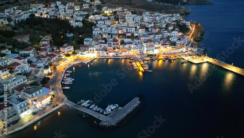 Dusk aerial view of Batsi, a traditional village at the island of Andros, Cyclades, Greece photo