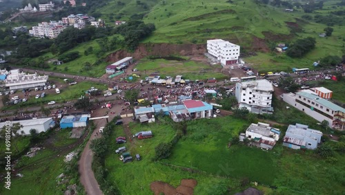Aerial view of the crowd of Hindu devotees taking on foot journey around the spiritual mountain of Brahmgiri in Trimbakeshwar, Nashik, Maharashtra, India