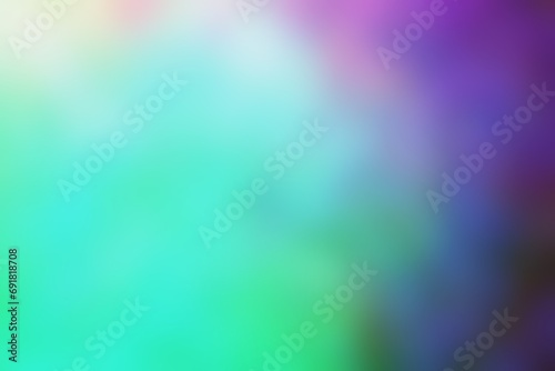 Abstract blurred background image of blue, green, pink colors gradient used as an illustration. Designing posters or advertisements.