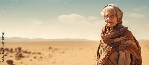 Elderly lady in the desert photo