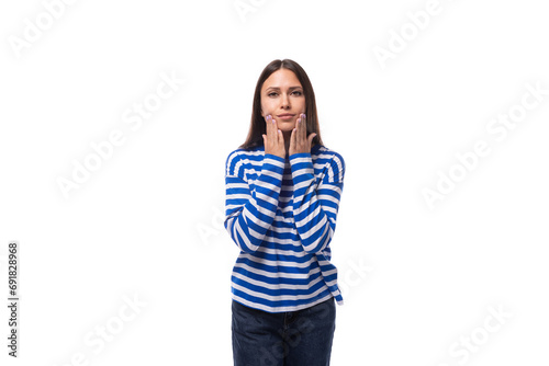 portrait of a young slender caucasian woman with straight dark hair looking in surprise at the camera