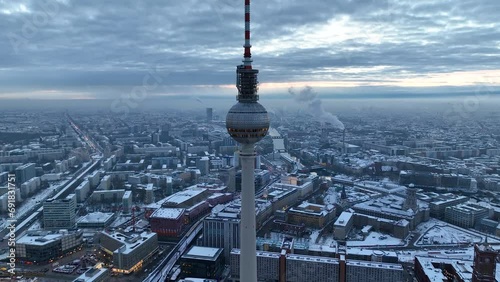 City of Berlin, Germany from above. Aerial winter cityscape view at sunrise or sunset, showing architectural landmarks Oberbaum Bridge, TV Tower and Berlin Cathedral in winter.  photo