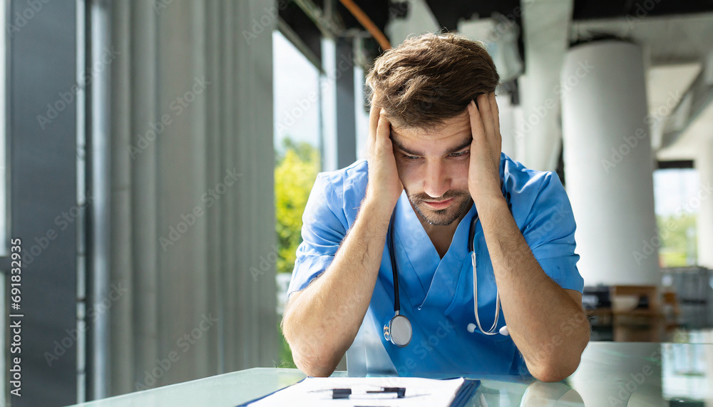 young medical assistant, nurse or doctor in the hospital or nursing home works in the care, exhausted or stressed with a negative facial expression - obrazy, fototapety, plakaty 