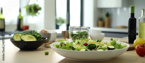 background of a bright white kitchen space, a platter adorned with vibrant green and black accents showcases a healthy mix of Japanese and Asian cuisine, including a delicious salad, reflecting the photo