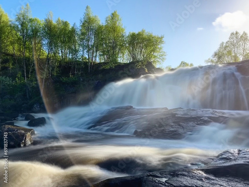 Waterfall in the forest near Murmansk, Russia, June 2019