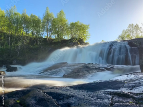Waterfall in the forest near Murmansk, Russia, June 2019