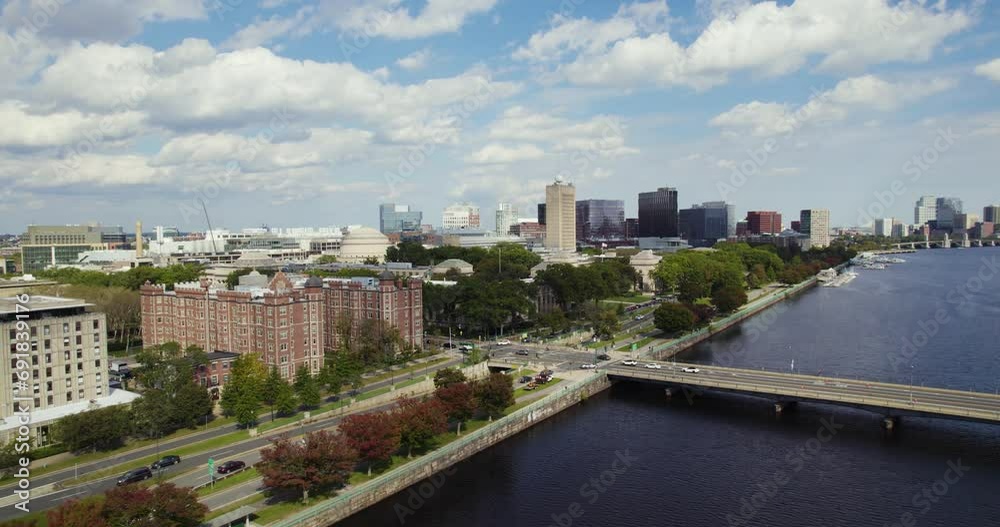 Traffic On Harvard Bridge Across Charles River In Boston, Massachusetts. aerial pullback
