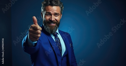 Man smiling and pointing at his beard in the style blue colour