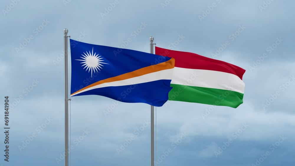 Hungary flag and Marshall Islands flag waving together on cloudy sky, endless seamless loop, two country relations concept Hungary flag and Marshall Islands flag waving together on cloudy sky, endless seamless loop, two country relations concept
