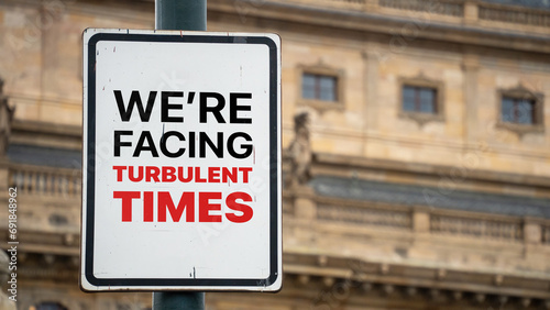 We're facing turbulent times on a sign in a city business district © WD Stockphotos