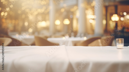 Empty product placement mockup of a white linen-covered table in a luxurious restaurant, with folded napkins and a blurred warm, inviting background, perfect for dining ambiance.