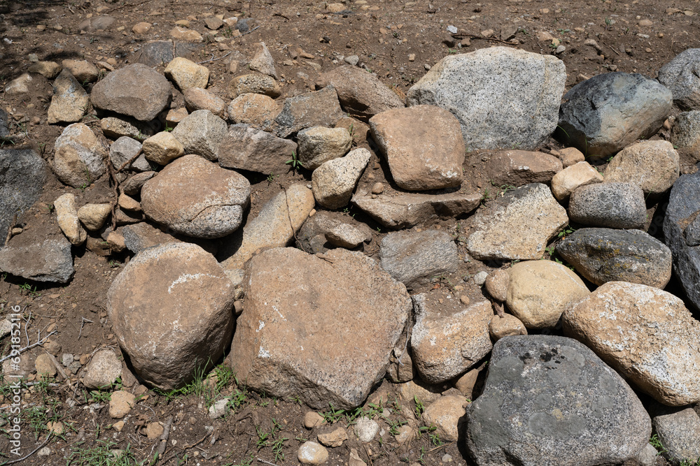 Rock retaining wall in backyard. Designed to prevent erosion. Rock retaining wall in backyard. Designed to prevent erosion.