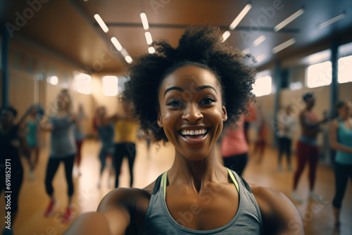 Selfie of a cheerful black woman at a a fitness class