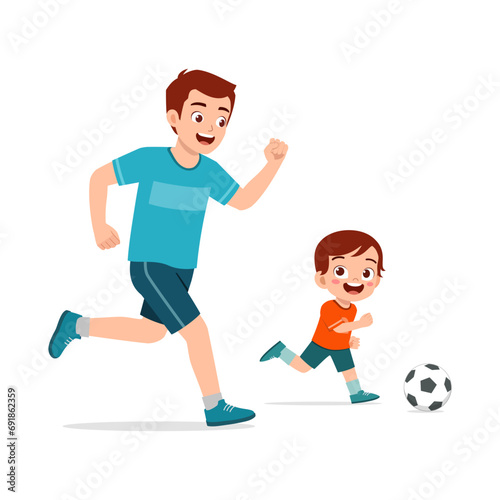 little kid with father play foot ball