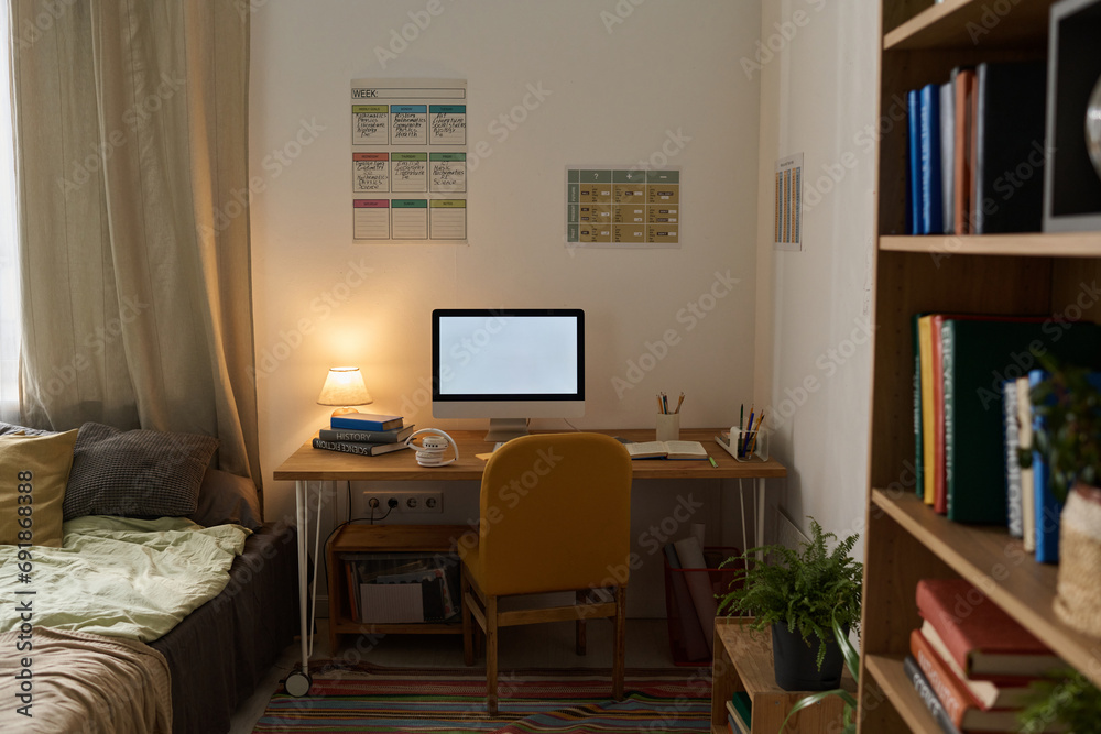Modern workplace with computer monitor in teenage room Modern workplace with computer monitor in teenage room