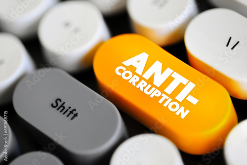 Anti-Corruption - comprises activities that oppose or inhibit corruption, text concept button on keyboard photo