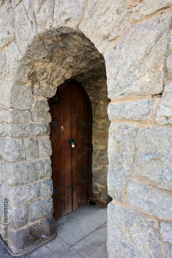 ancient cellar door to a century old clock tower