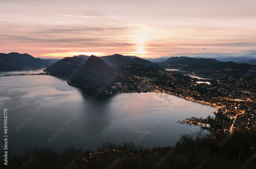 Sunset view from Monte Bre over the city of Lugano in Ticino, Switzerland.