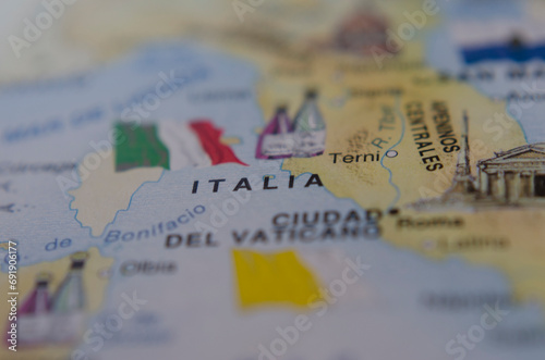 close up shot of the map of italy with its flag