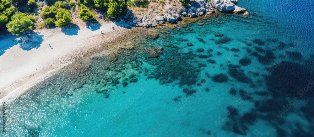 Aerial top view footage of crystal clear water beach of Seitani in the Aegean island Samos. Copy space image. Place for adding text