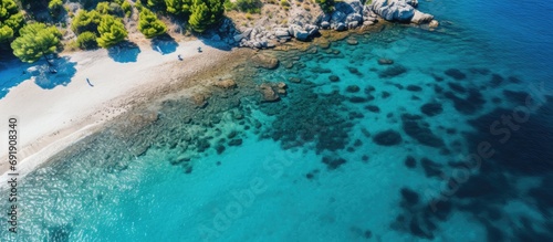 Fototapeta Naklejka Na Ścianę i Meble -  Aerial top view footage of crystal clear water beach of Seitani in the Aegean island Samos. Copy space image. Place for adding text