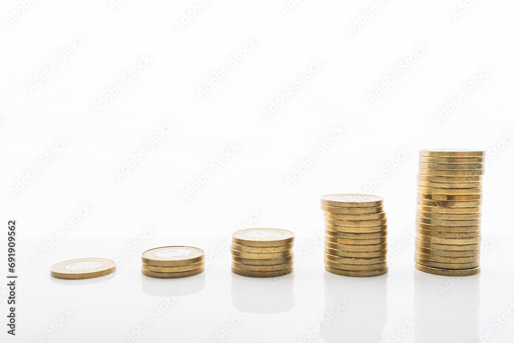 Coins stacked on white backgroud with smooth reflection. Concept of grow, investment, saving money. Coins stacked on white backgroud with smooth reflection. Concept of grow, investment, saving money.