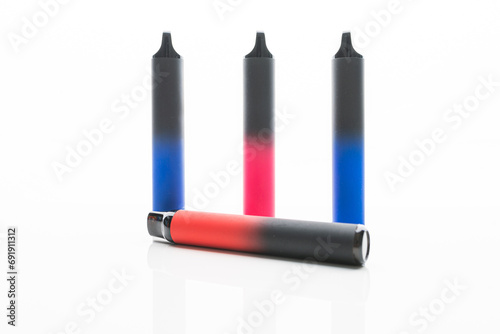 Disposable electronic cigarettes. Set of colorful e-cigarettes of different shapes. Concept of modern smoking. © michaldziedziak