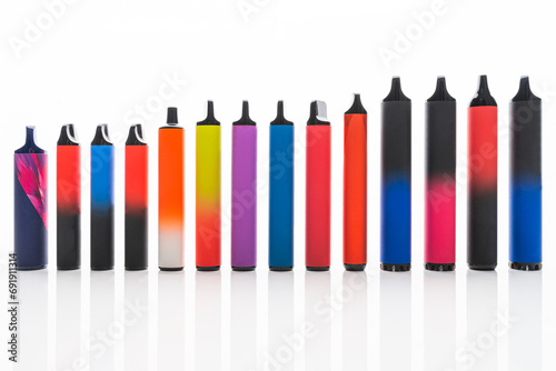 Disposable electronic cigarettes. Set of colorful e-cigarettes of different shapes. Concept of modern smoking. © michaldziedziak