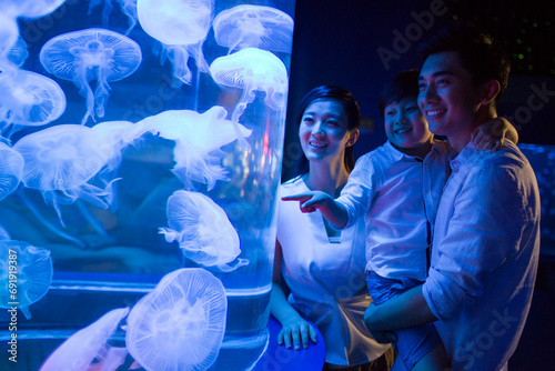 Young family in aquarium photo