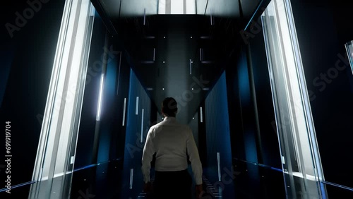 Programmatic advertising. Man in Futuristic Office Interior Moving and Activating Hologram. photo
