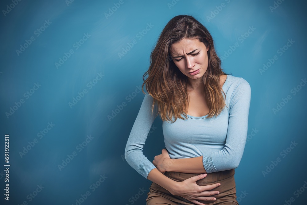 woman in pain holding her belly, stomach ache - obrazy, fototapety, plakaty 