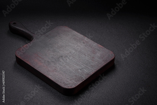 Empty wooden cutting board for preparing ingredients for preparing a delicious dish photo