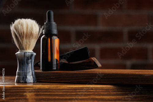 Leinwand Poster Cosmetics for man, Bottle essential oil for beard men on background dark brick