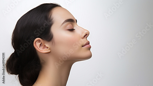 side view of a woman on white background