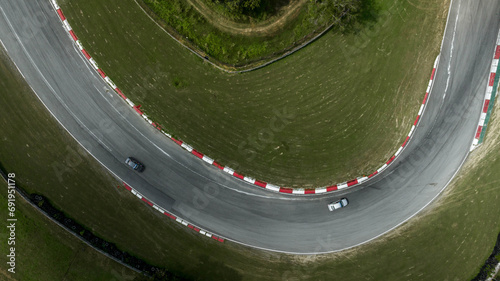 Aerial top view of Circuit motor racing track, Track for auto racing top view, Car race asphalt and curve grand prix street circuit, Aerial view asphalt race track. © Darunrat