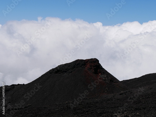 Eruptive cone of piton de la Fournaise volcano on top of clouds, Reunion, France photo