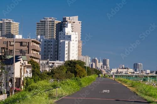多摩川河川敷とマンションの風景　Scenery of Tama River riverbed and apartment building photo