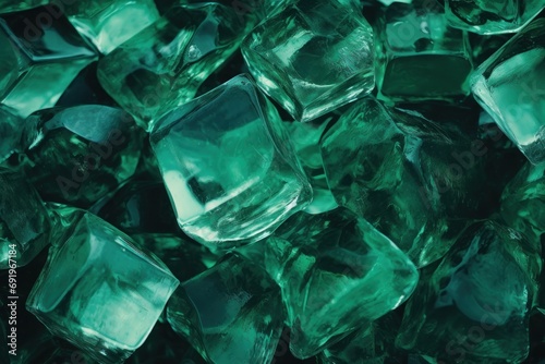  a pile of green ice cubes sitting on top of a pile of green ice cubes on top of a table.