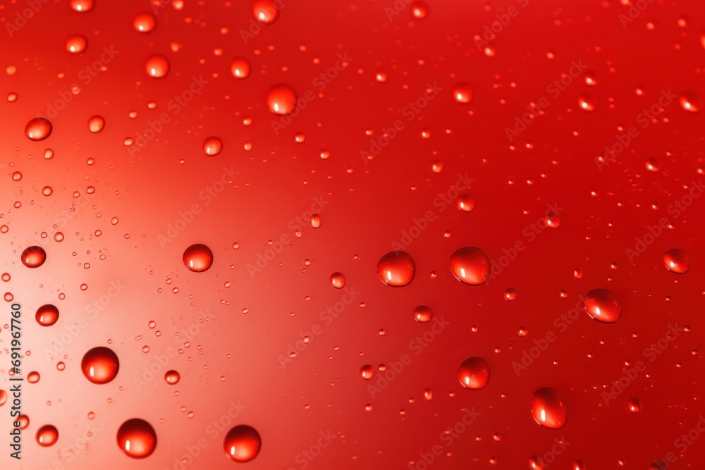 drops of water on a red surface with a red back ground and a red back ground with a red back ground. drops of water on a red surface with a red back ground and a red back ground with a red back ground.