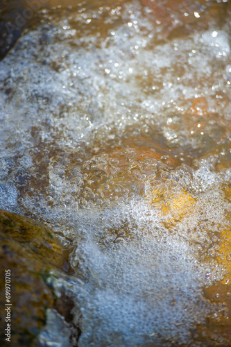 The water in a mountain stream represents fearlessness and perseverance. Finding Your Way: The concept of overcoming challenges with clarity and determination. © Alexandr