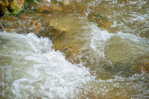 Mountain Creek. Stones water Experience the tranquility of a sparkling mountain stream. Find inner peace in the soothing rhythm of flowing water. Immerse yourself in the beauty and energy of nature.