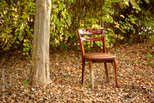 red chair in autumn park