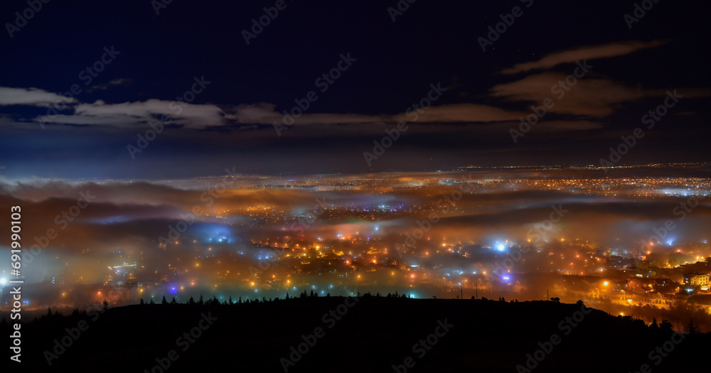 Lights of the City Under the Fog