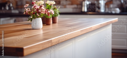 a wooden counter in a white kitchen