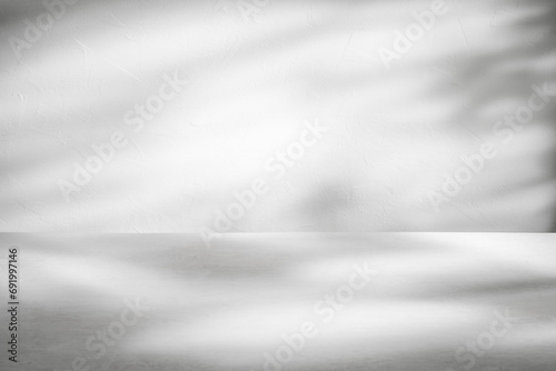 White or light grey background with stone wall with light and shadows for product presentation with copy space