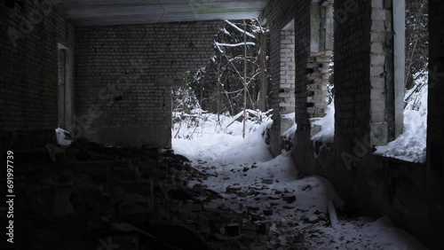 Interior of an abandoned brick building in winter 4k slow motion photo