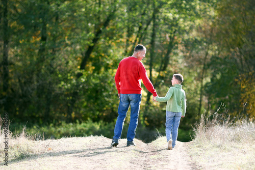 father walks with child emotions concept family